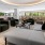 A large clubroom with ample seating and large windows